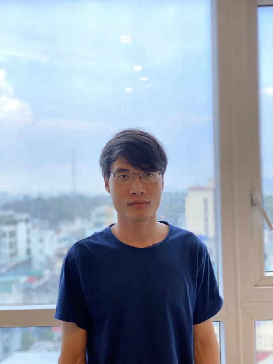 Thanh Pham working with colleagues